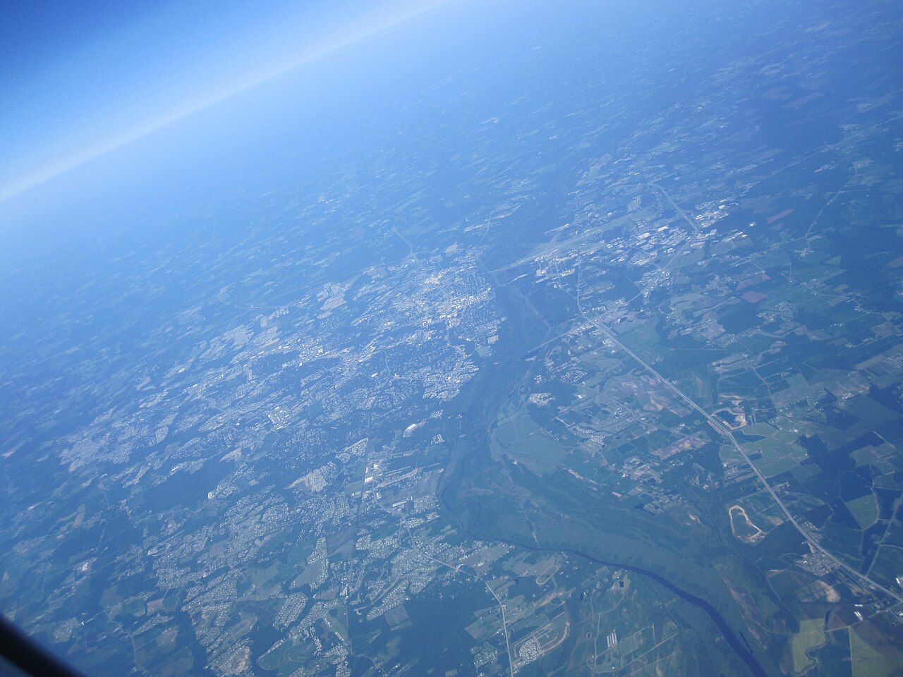 Aerial view of Greenville, North Carolina, with trees and buildings