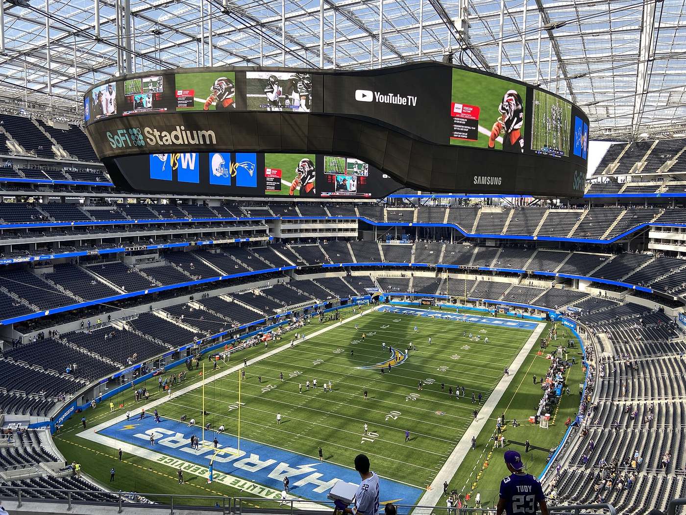 The inside of SoFi Stadium with its large video board above the field