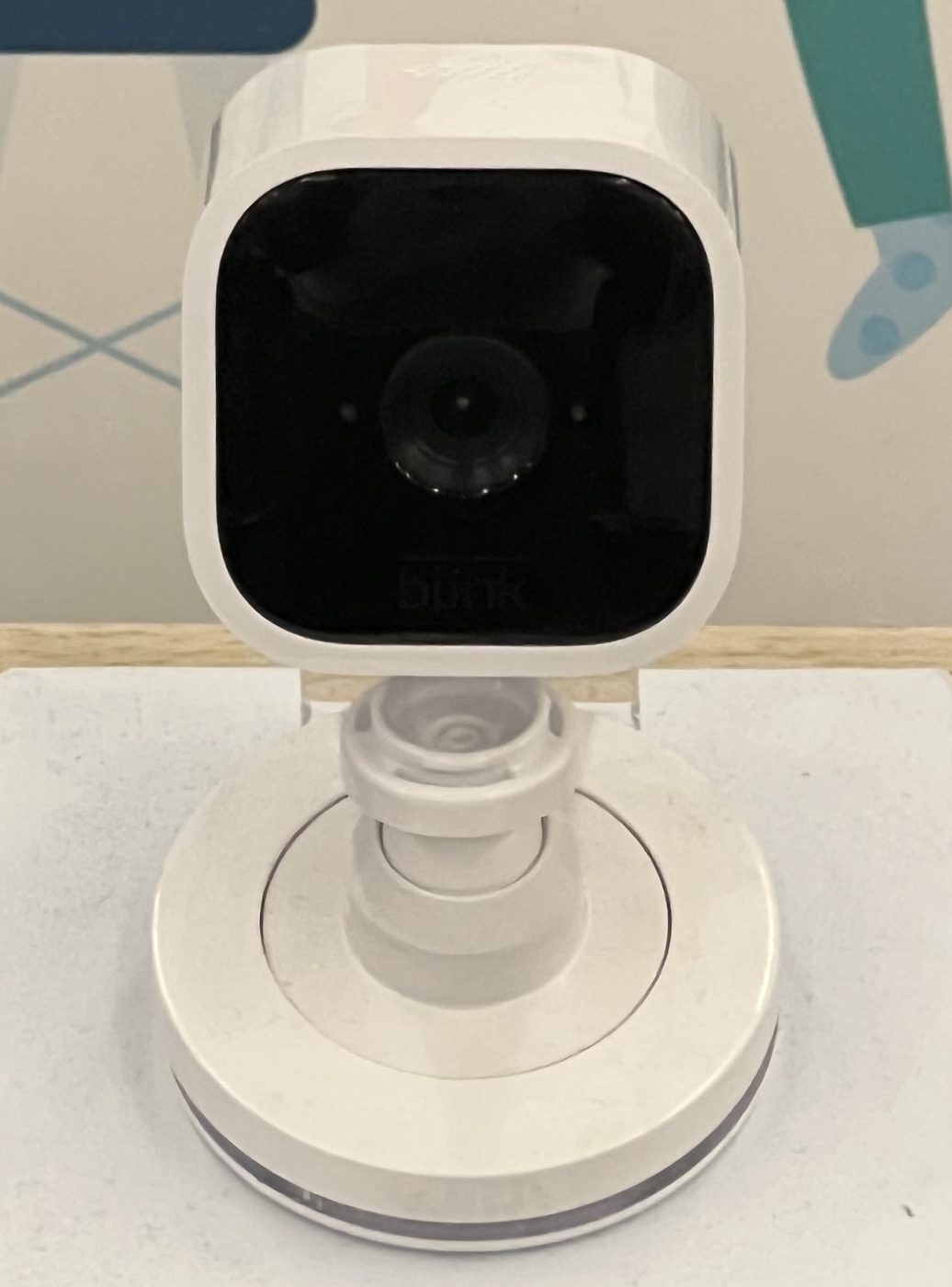 A Blink Mini security camera on a table