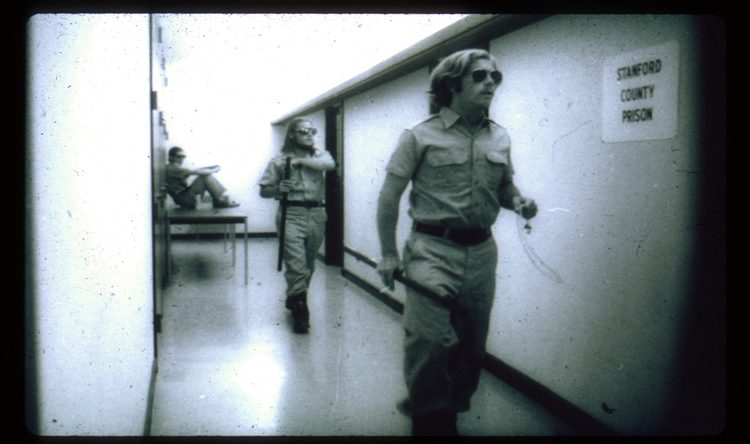 Guards walking in the yard of the original 1971 Stanford prison experiment