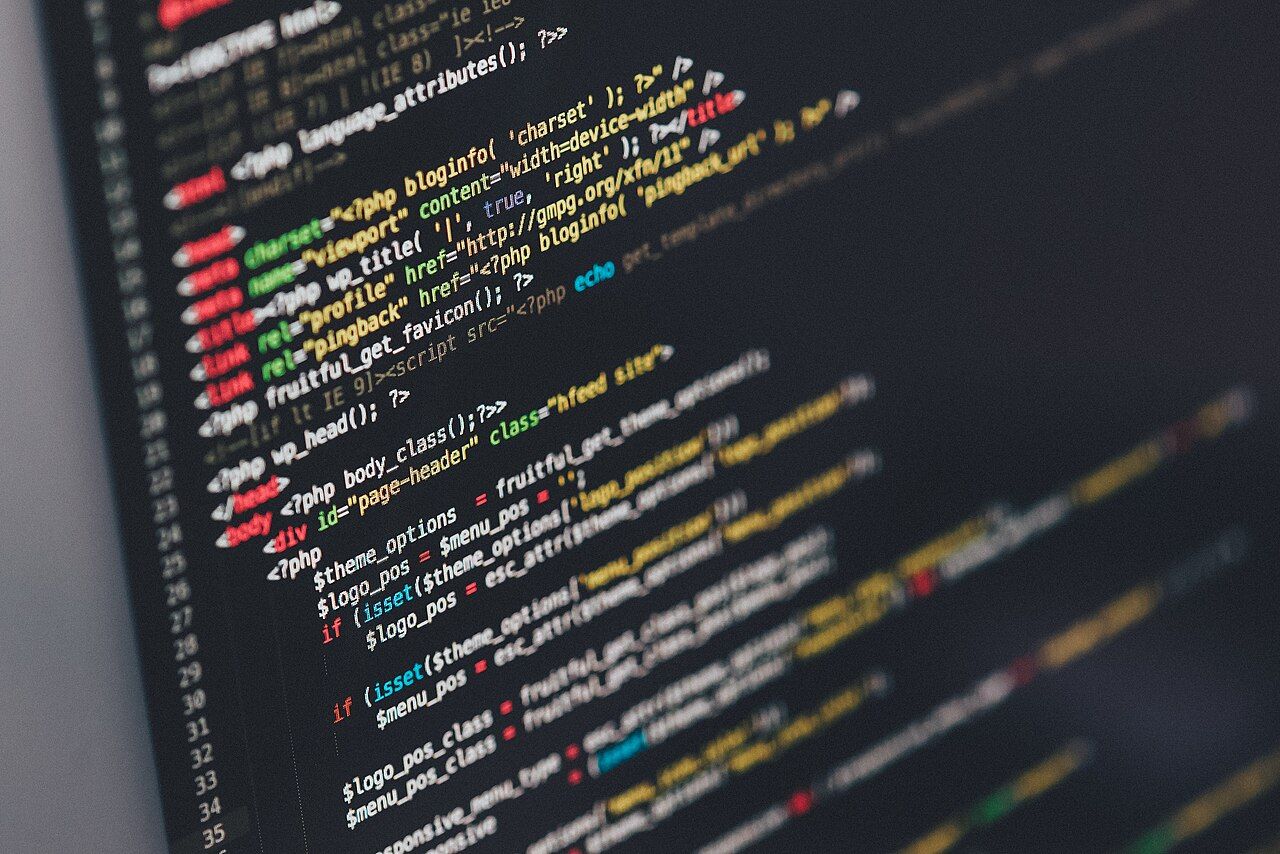 Lines of colorful computer code on a dark screen