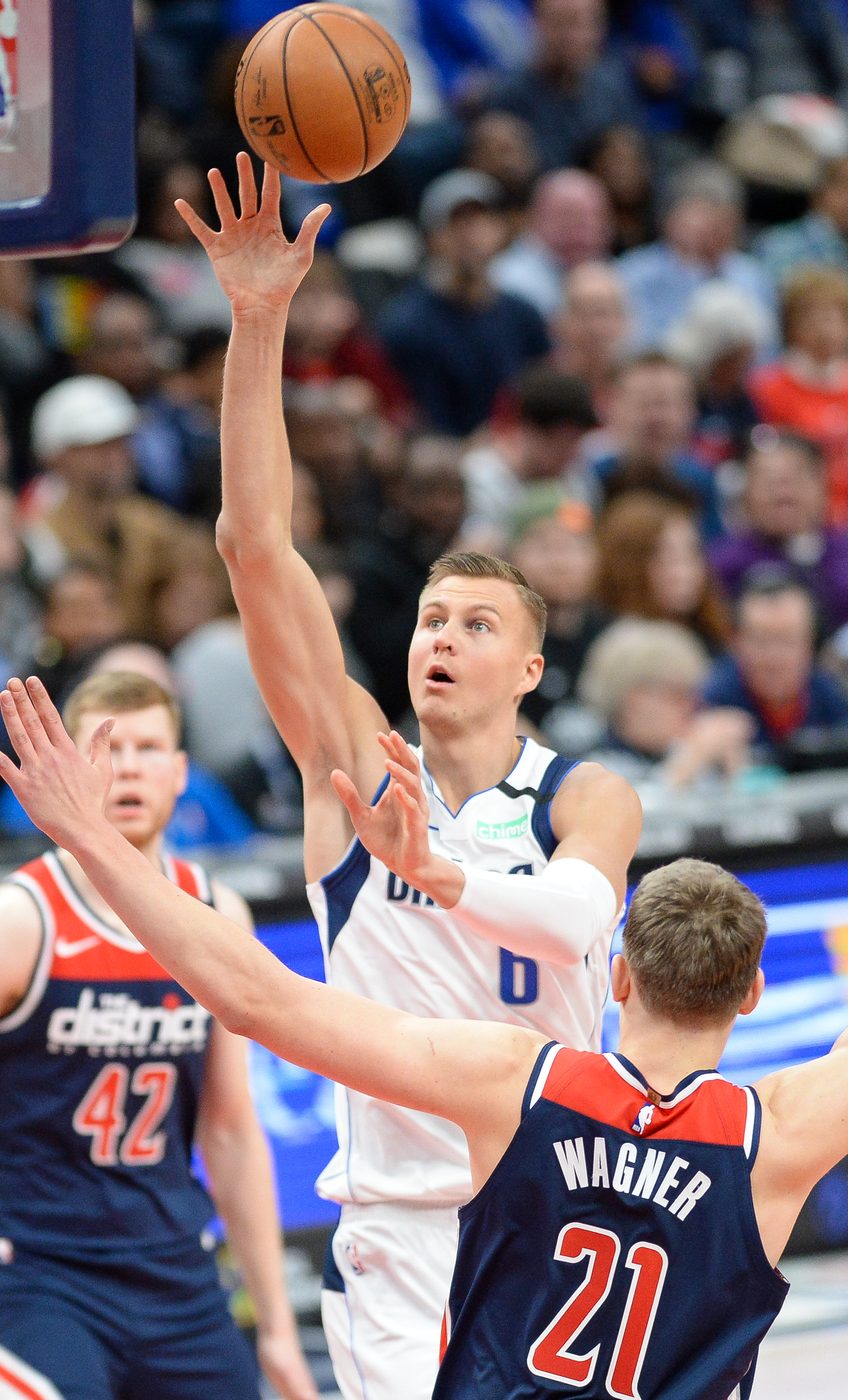 Kristaps Porzingis shooting a floater during an NBA game