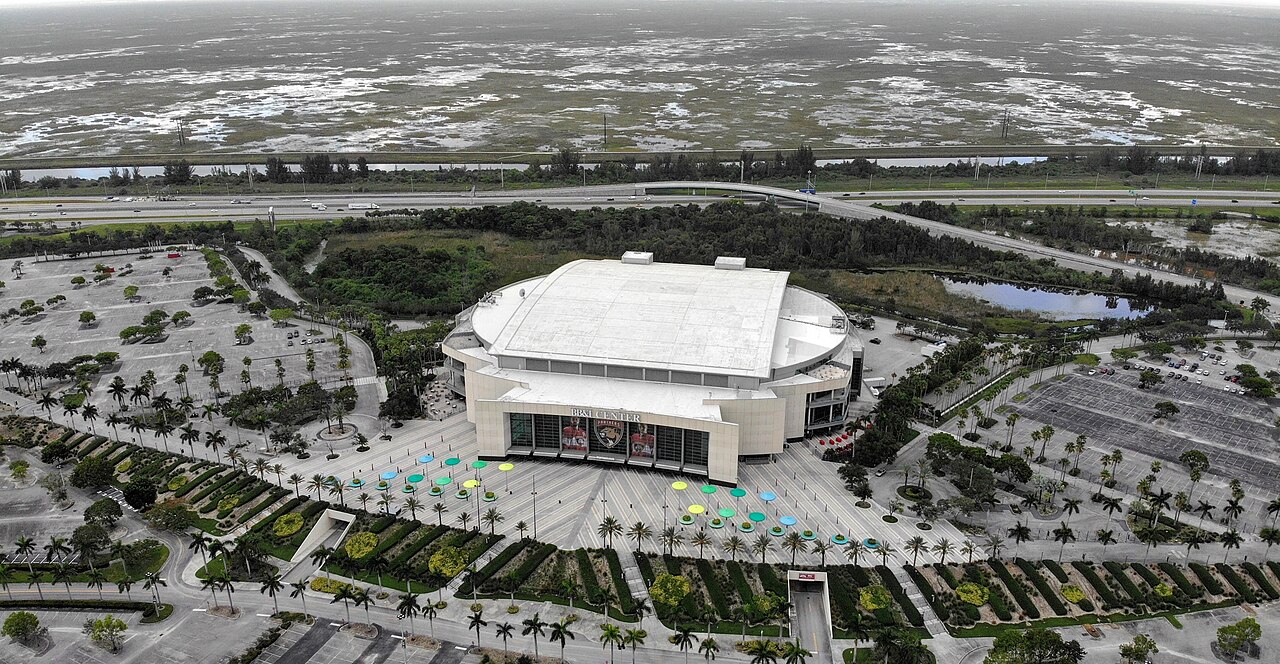 An aerial view of a large arena surrounded by parking lots in Florida