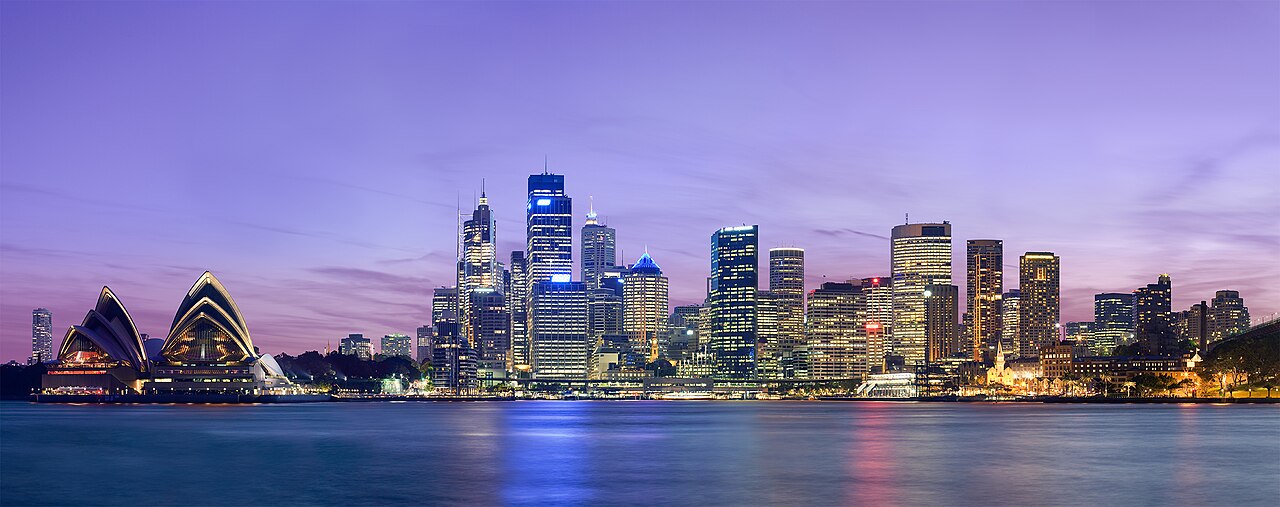 The Sydney skyline across Sydney Harbour at dusk