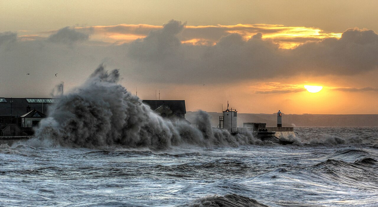 Large waves crash against the seafront in Porthcawl, Wales, during a storm