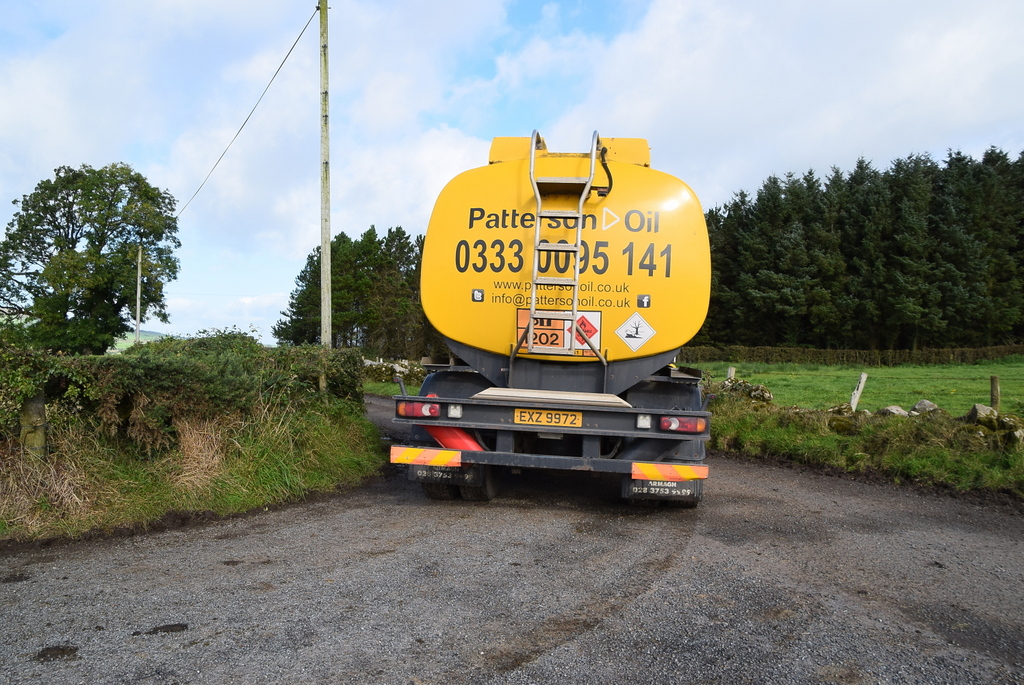 A heating oil delivery truck parked on a road