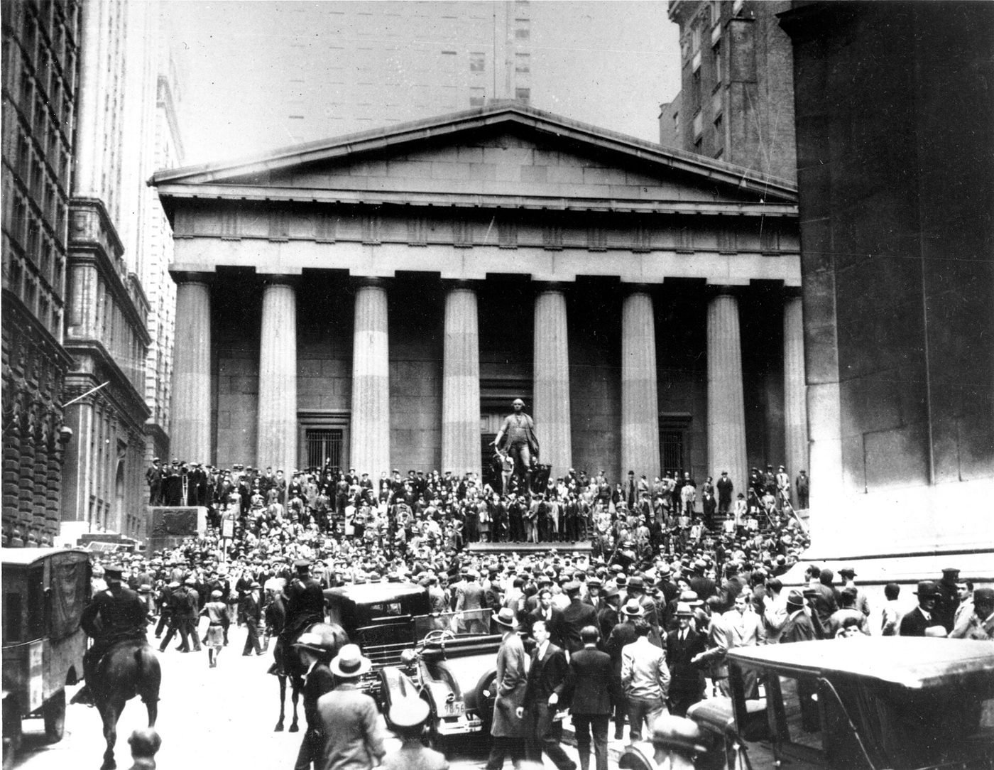Crowds panic in the Wall Street district of Manhattan due to the heavy trading on the stock market in New York City o...