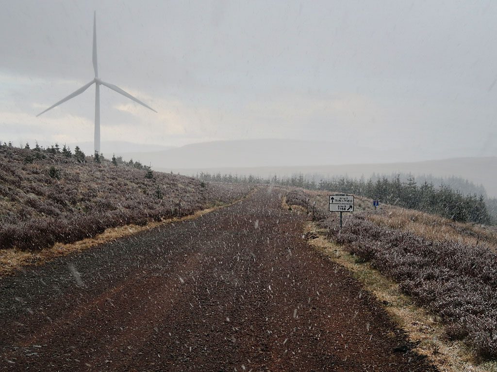 A wind farm track in a snow storm in Scotland