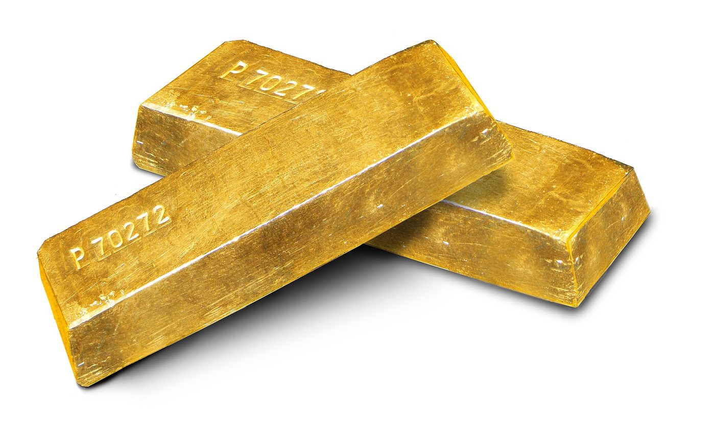 Stacked gold ingots on a white background