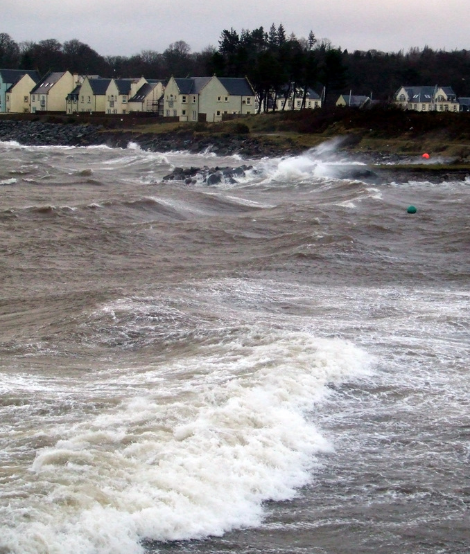 Storm waves crash against the seafront at Inverkip on the Firth of Clyde