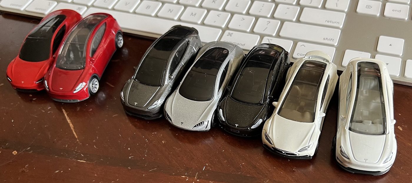 Hot Wheels and Matchbox toy cars on a table