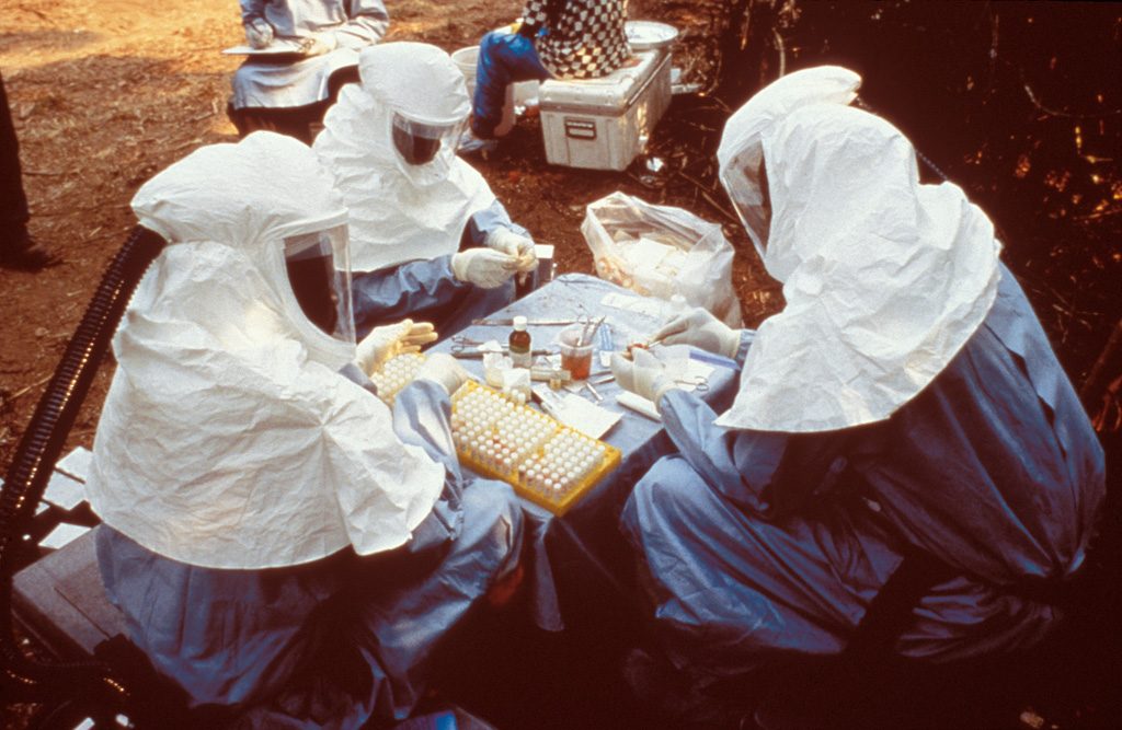 Health workers in protective gear during an Ebola response
