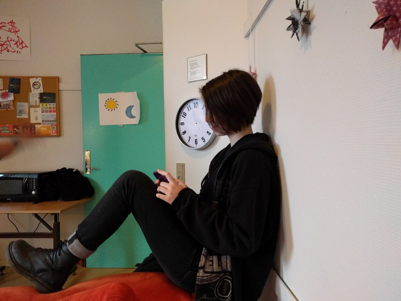 A teenager using a mobile phone