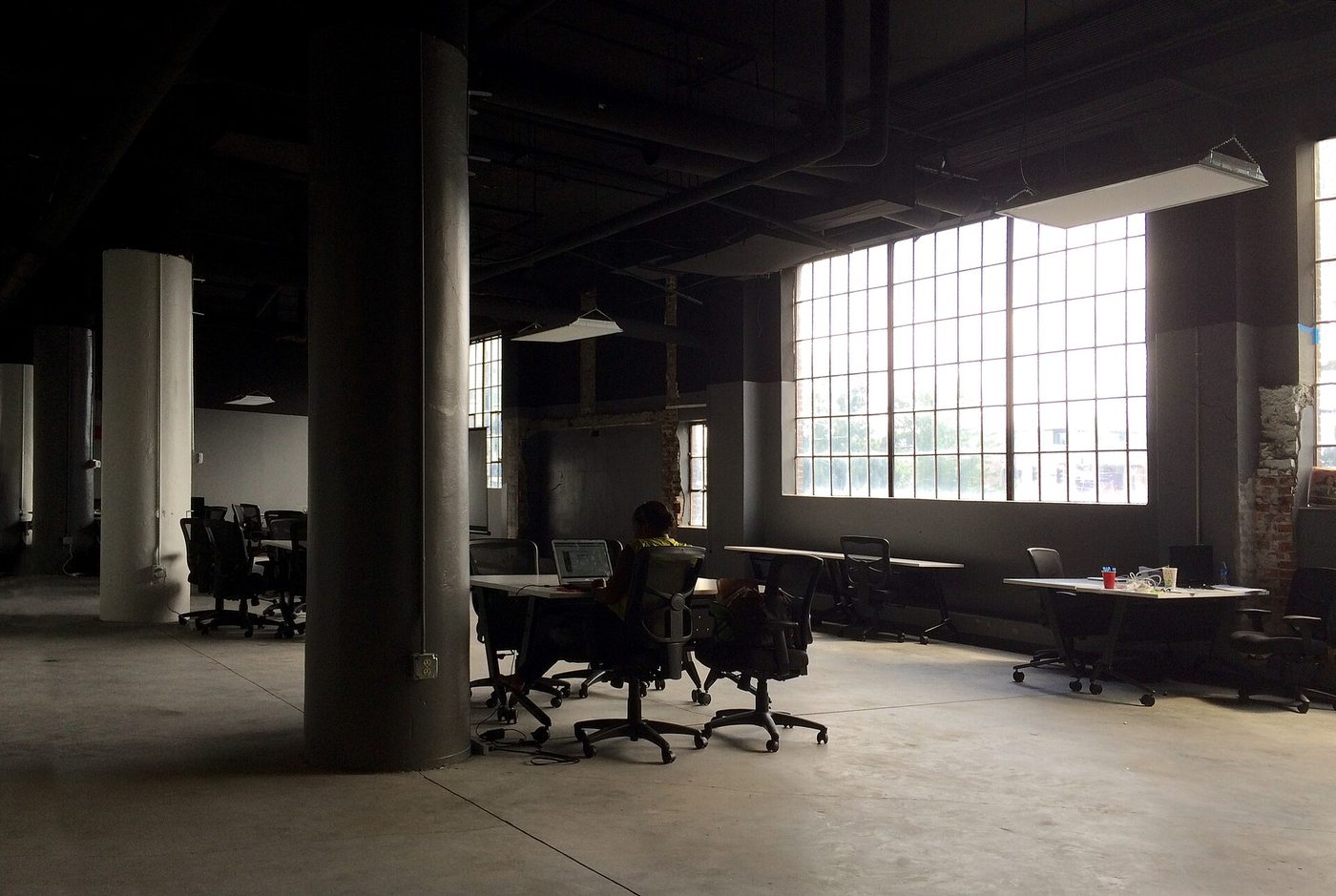 A person working alone at a desk