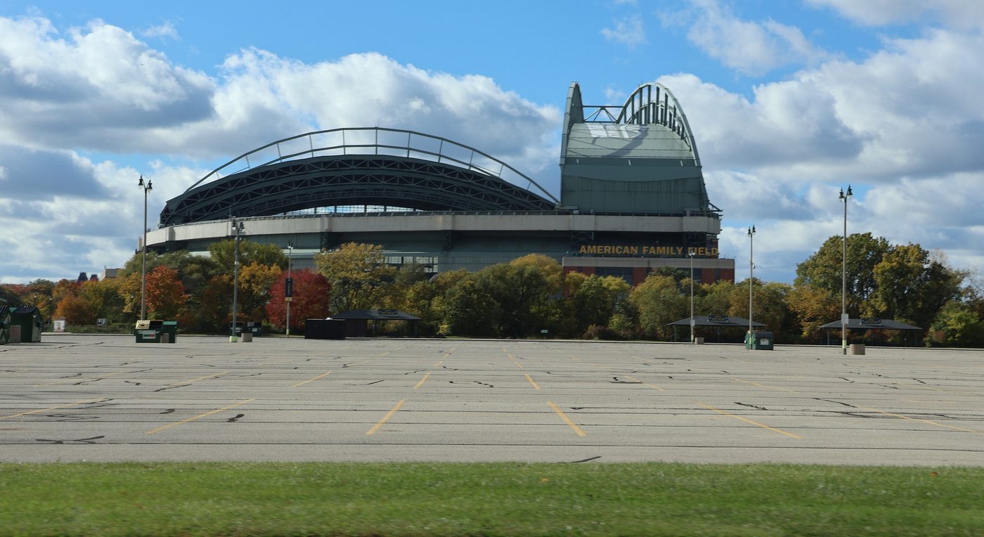 American Family Field in Milwaukee with its roof closed, seen from a parking lot