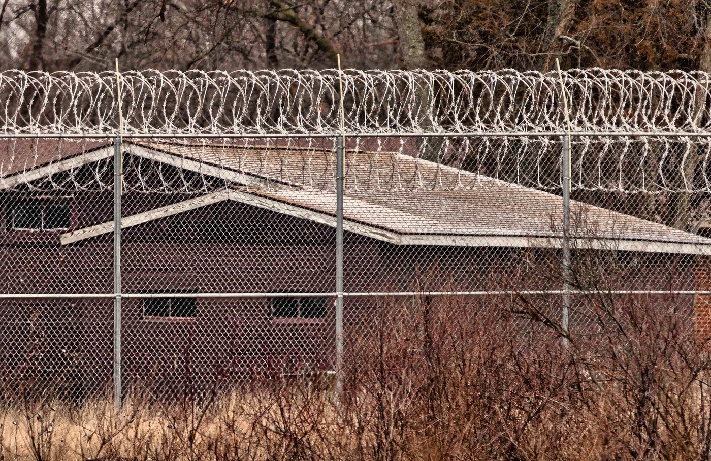 Rolls of razor wire on top of a fence at a prison in Michigan