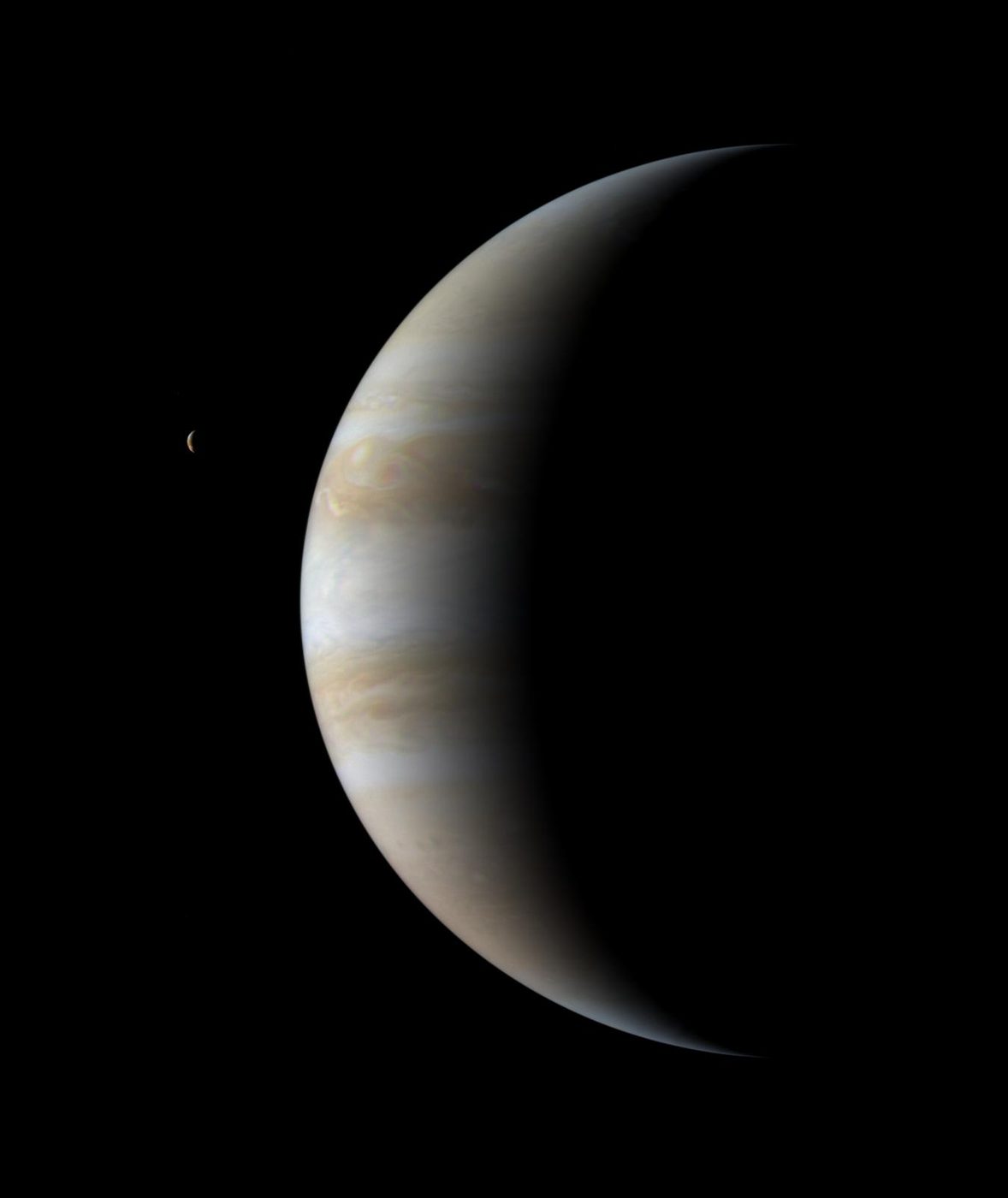 A thin crescent of Jupiter against black space