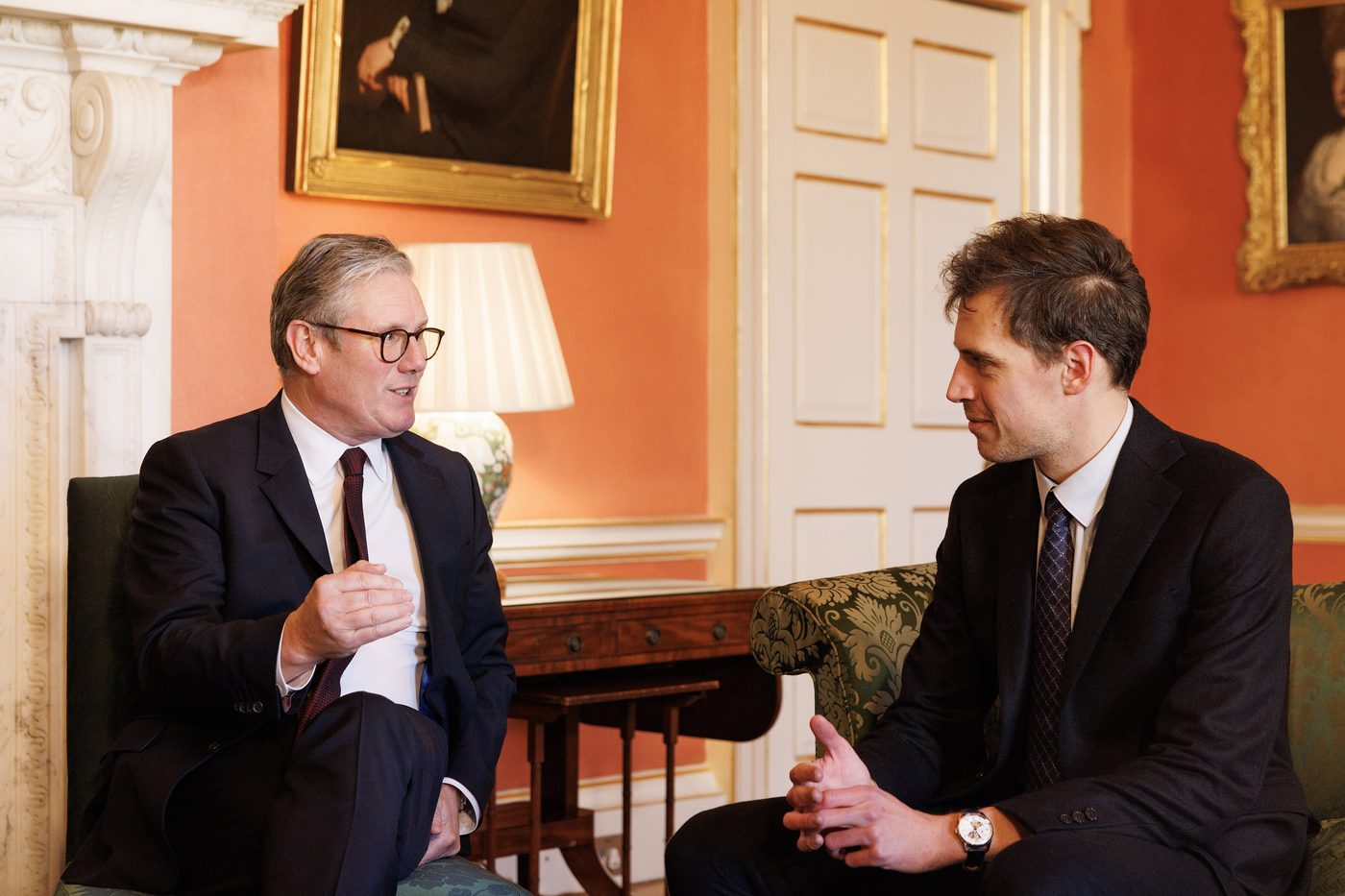 Mistral AI chief Arthur Mensch speaks with British Prime Minister Keir Starmer in a Downing Street room