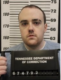 Booking photo of Jacob Morley, a man with short brown hair, holding a Tennessee Department of Correction placard
