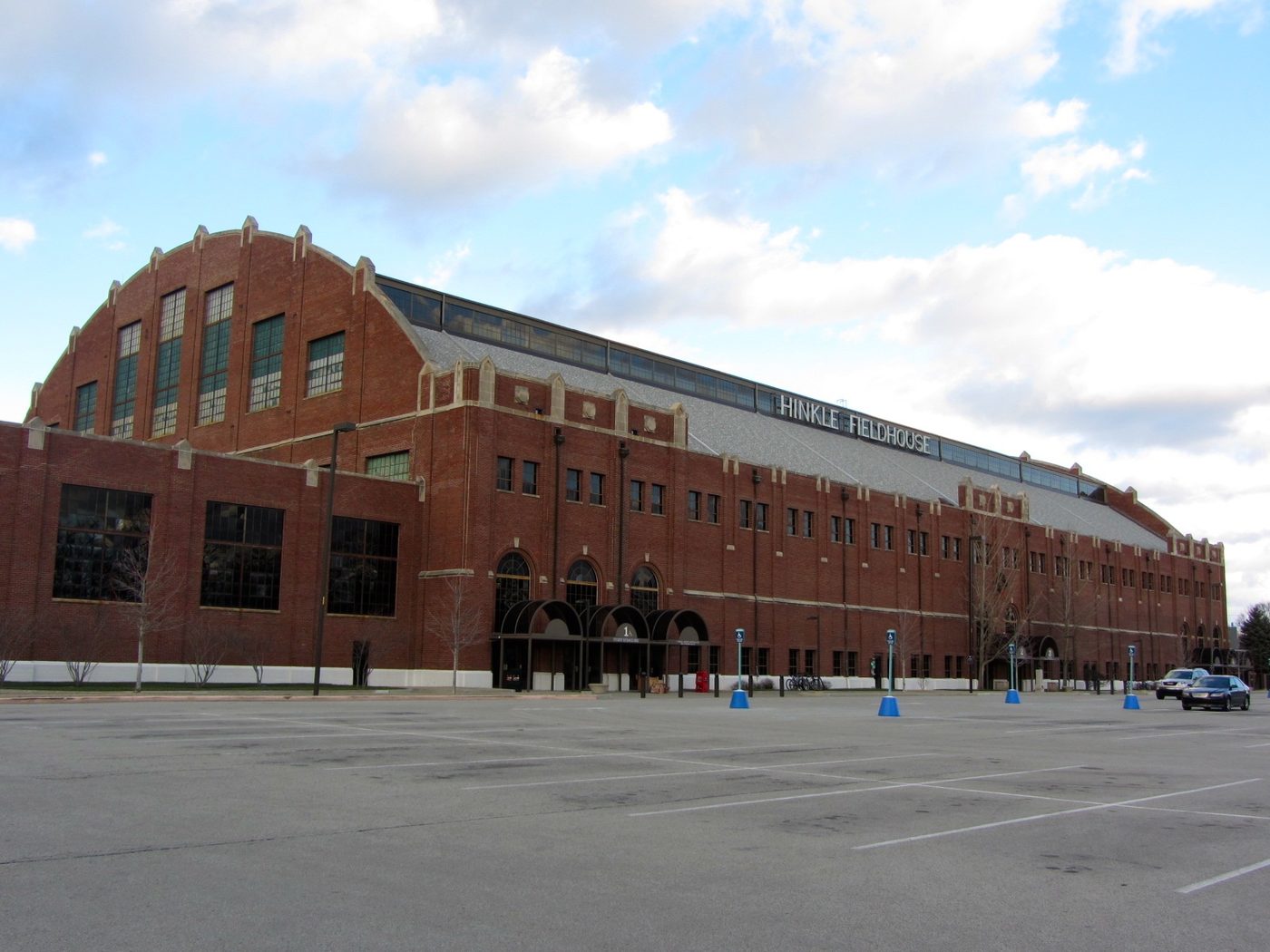 The brick exterior of Hinkle Fieldhouse under a blue sky