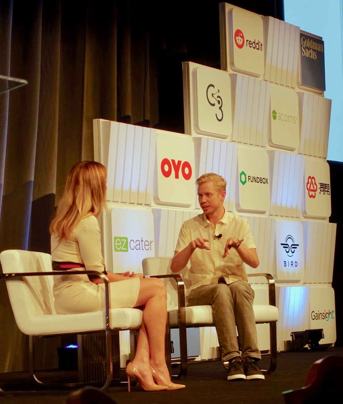 Reddit chief executive Steve Huffman speaking on stage at a conference