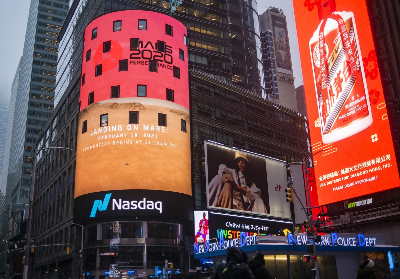 The Nasdaq MarketSite tower in Times Square lit up with large digital displays
