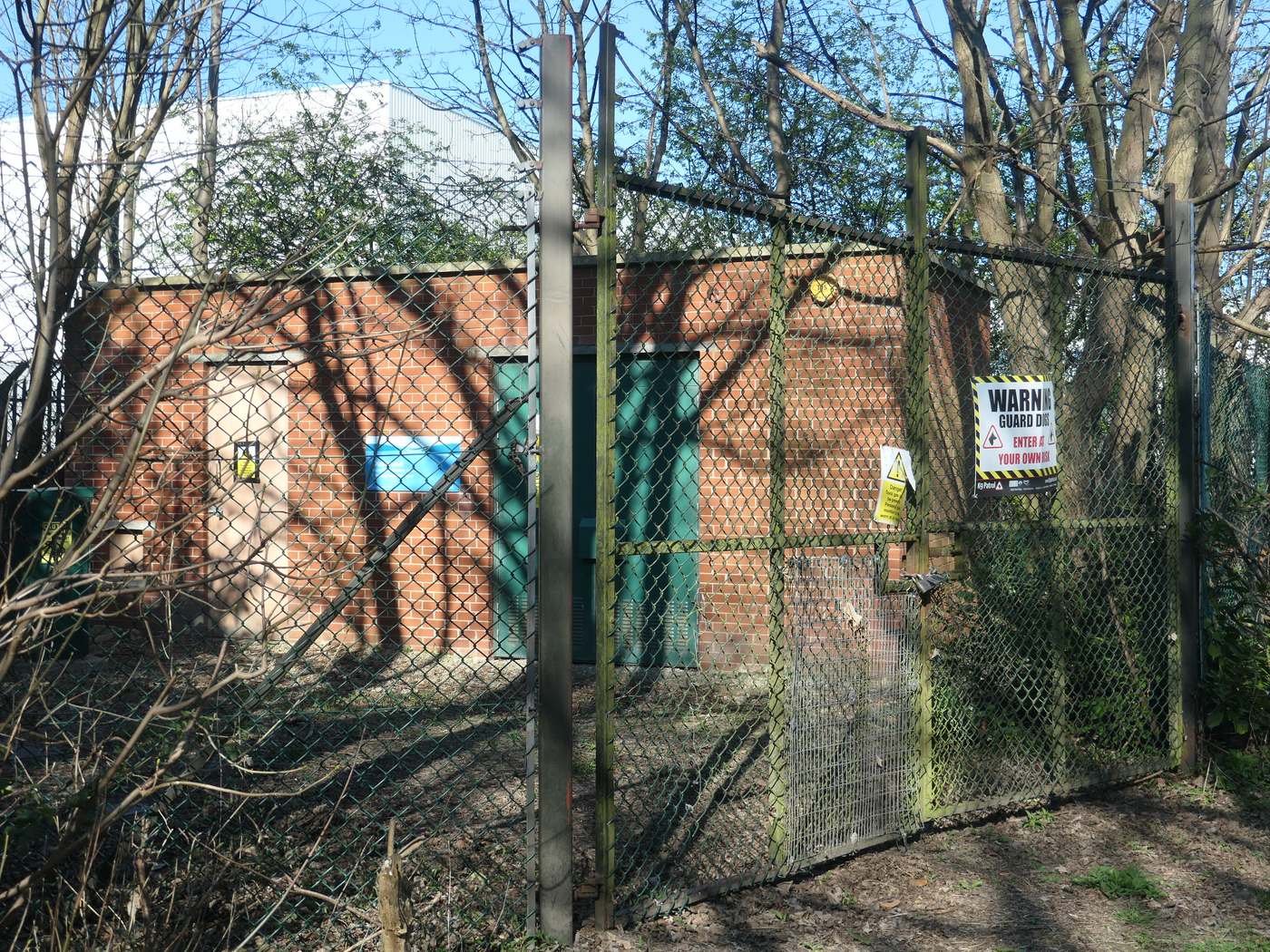 A Yorkshire Water building with a fence and trees in front