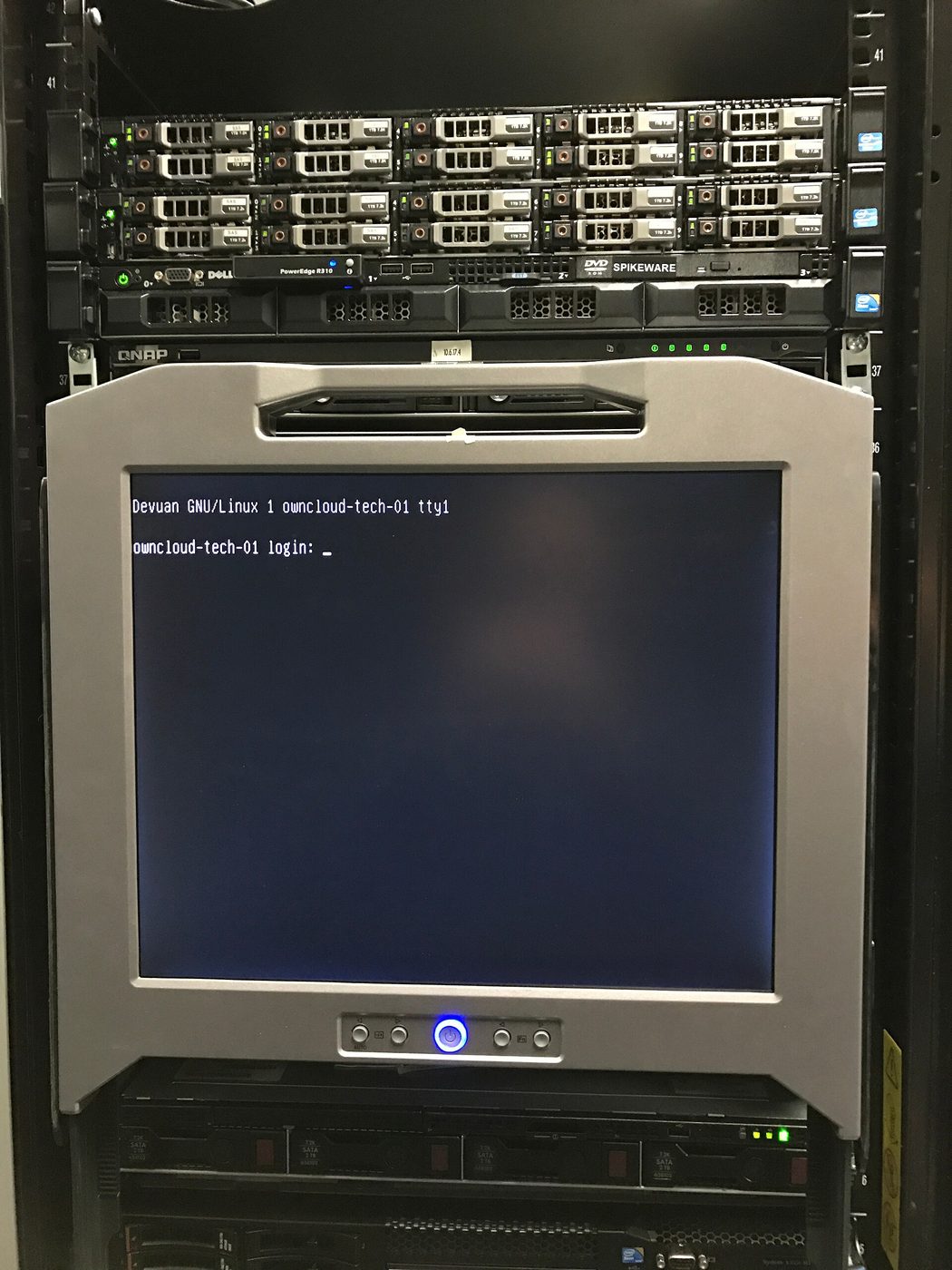 A Linux login screen on a monitor mounted in a server rack