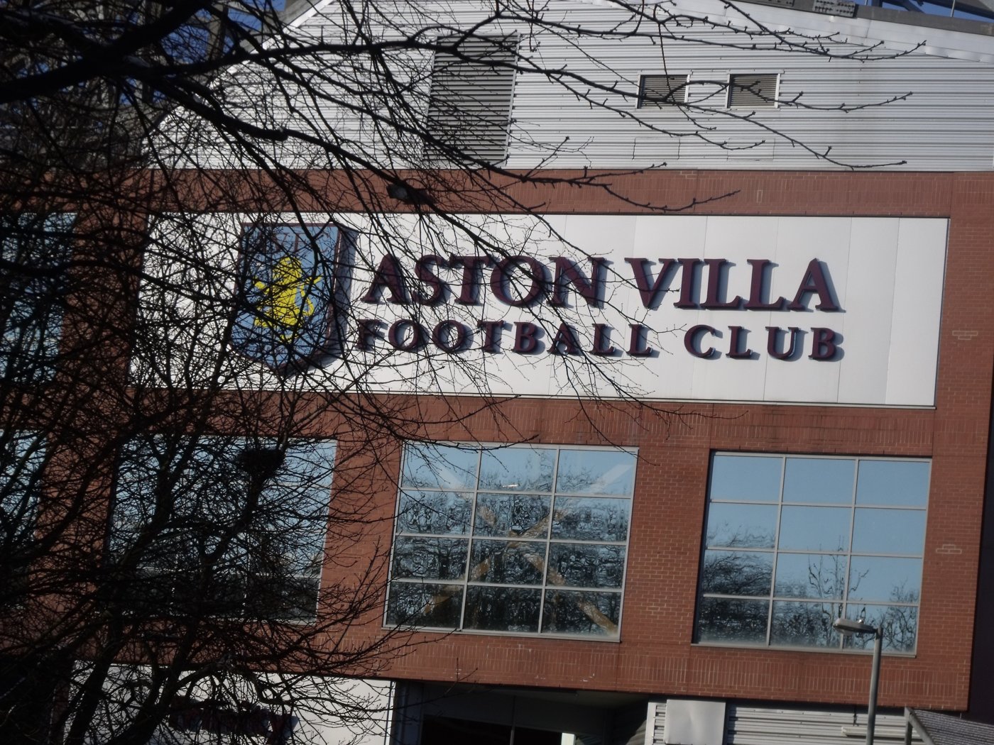 The Aston Villa Football Club sign on the brick Trinity Road Stand at Villa Park