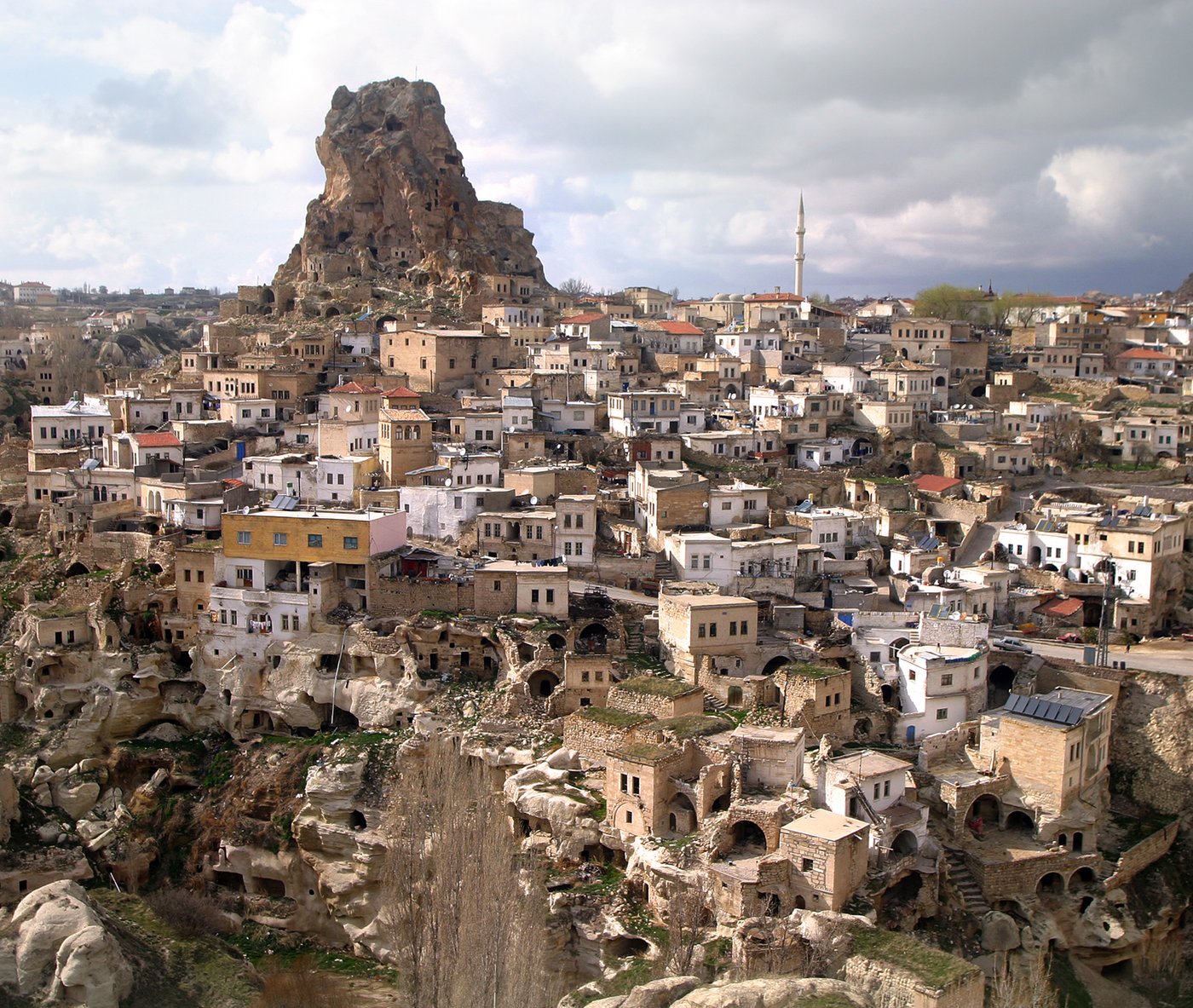 Rock spires and cave homes rise above the town of Ortahisar in Cappadocia