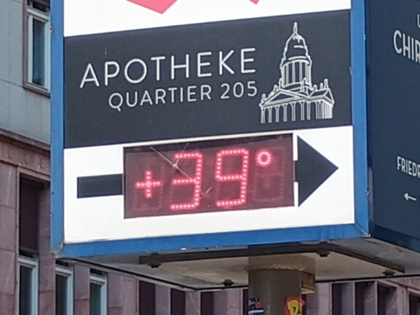 A pharmacy sign in Berlin shows a temperature of 39 degrees
