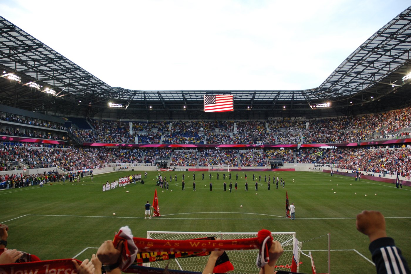 A view across the pitch from behind the goal at a soccer stadium