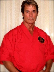 Actor and martial artist Richard Norton in a red martial arts jacket