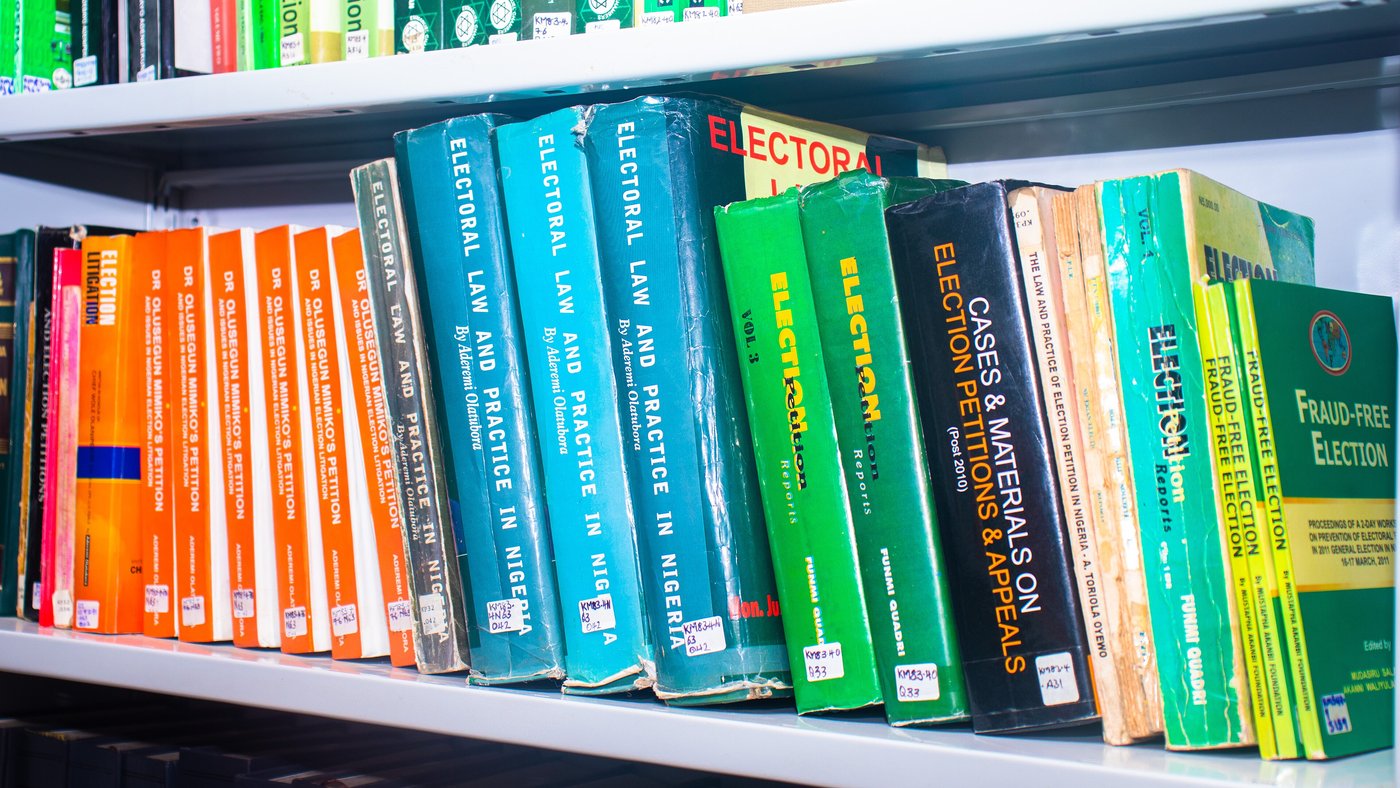 Rows of law books line the shelves of a library